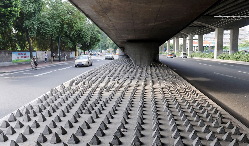 Concrete spikes under a road bridge in Guangzhou city, Guangdong, China. Photograph: Imaginechina/REX