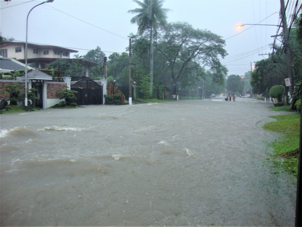 Massive flooding in a city caused by tropical storms in the Philippines.