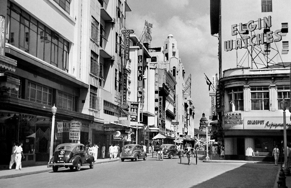 Early urban development of walk-up apartments and shophouses in the Philippines.