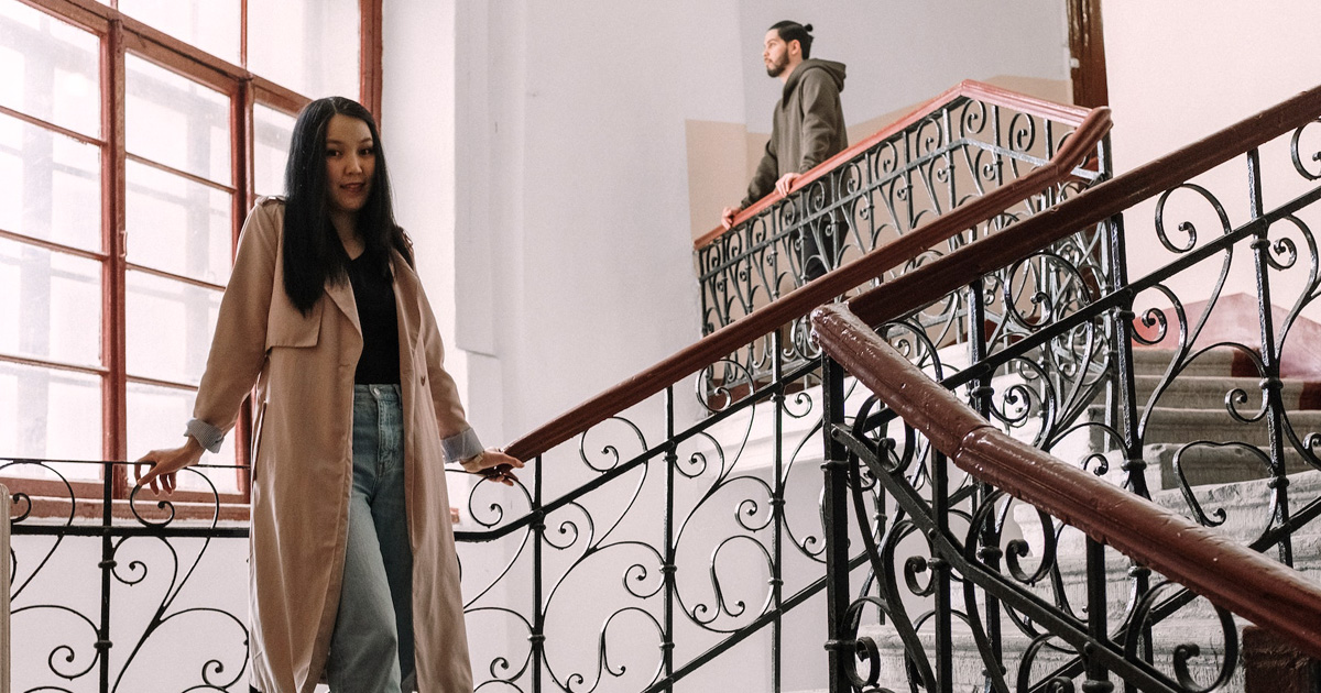 Woman and man standing on separate levels on a staircase celebrating valentine's day in the philippines