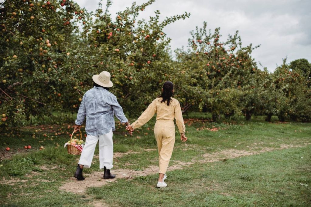 Two women walking in a farm resort in the Philippines.