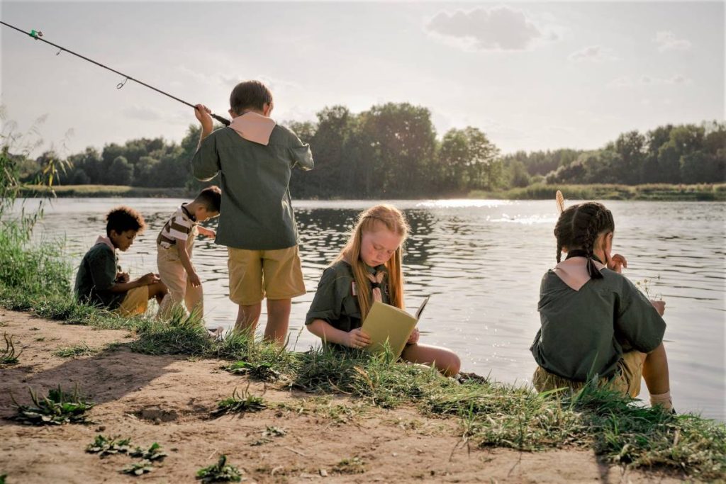 Children catching fish in a farm resort in the Philippines.