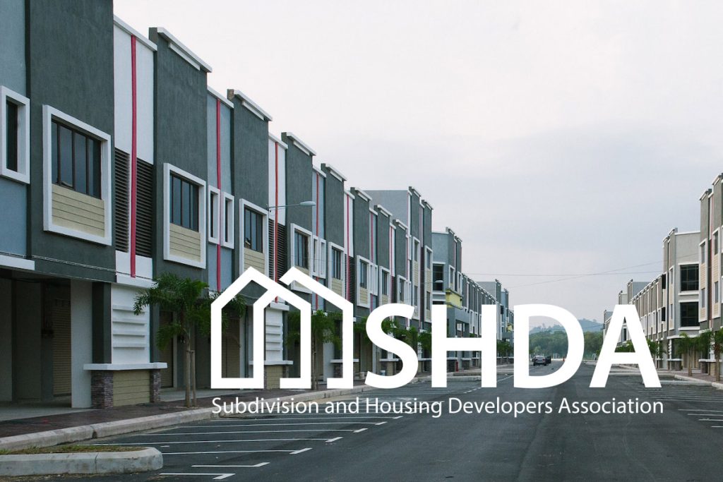 A logo of SHDA, symbolizing its commitment to housing development and urban planning in the Philippines.