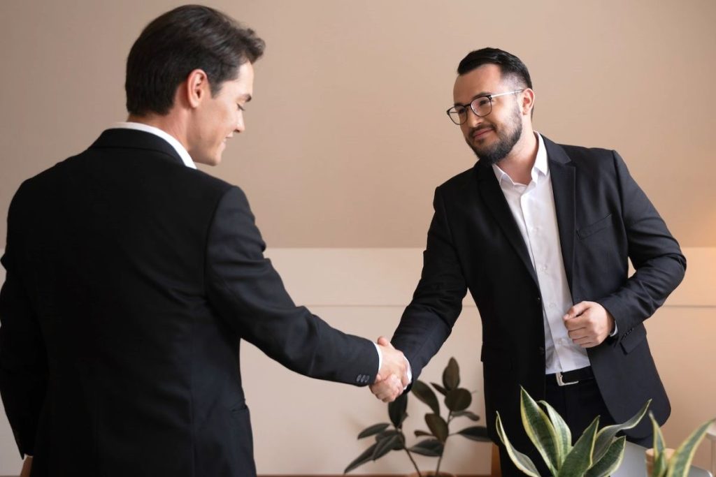 Handshake between landowner and developer