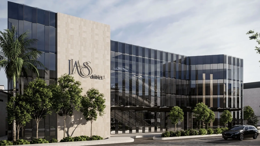 Lanson Integrated Estate retail and service office wing featuring vertical stone cladding, full-height glazed facade, landscaped sidewalk, and low-rise commercial architecture.