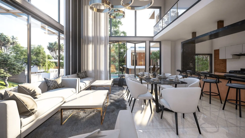 Open-plan living room with floor-to-ceiling glass windows, modular seating, modern kitchen with island, dining area with pendant lighting, and integrated views of landscaped garden