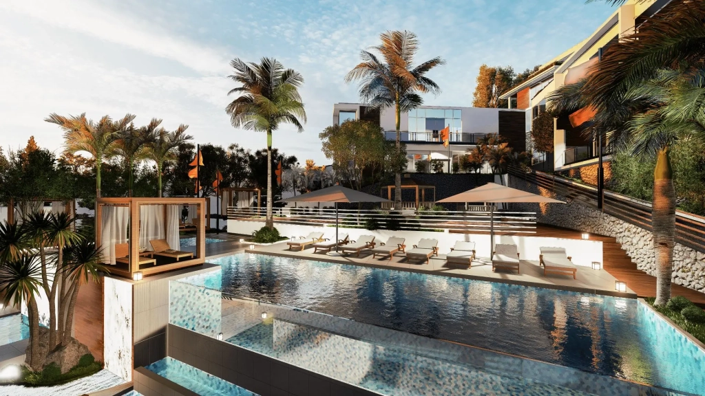 Tiered resort pool area with infinity edge pools, private cabanas with curtains, poolside loungers under umbrellas, palm trees, textured stone retaining walls, cascading water features, elevated terraces, landscaped gardens, and ocean-facing leisure deck integrated into a tropical hillside setting.