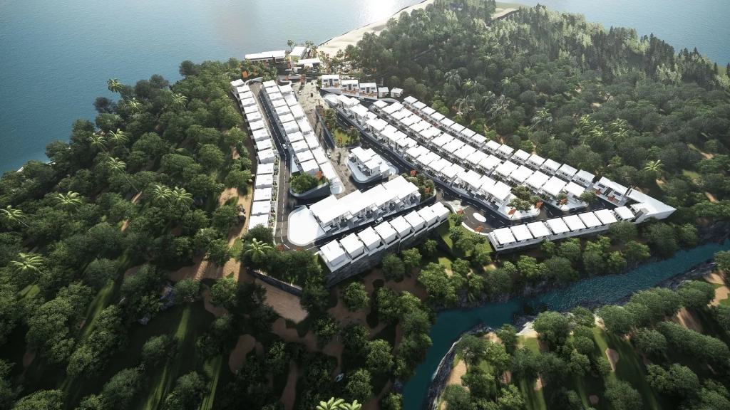 Aerial perspective of Ternate Coastal Estate showing organized residential blocks with white-roofed villas, curvilinear asphalt road networks, central community amenities, forested green buffers surrounding the development, turquoise coastal waters with beachfront access, distant forested hills, and winding river adjacent to the site.